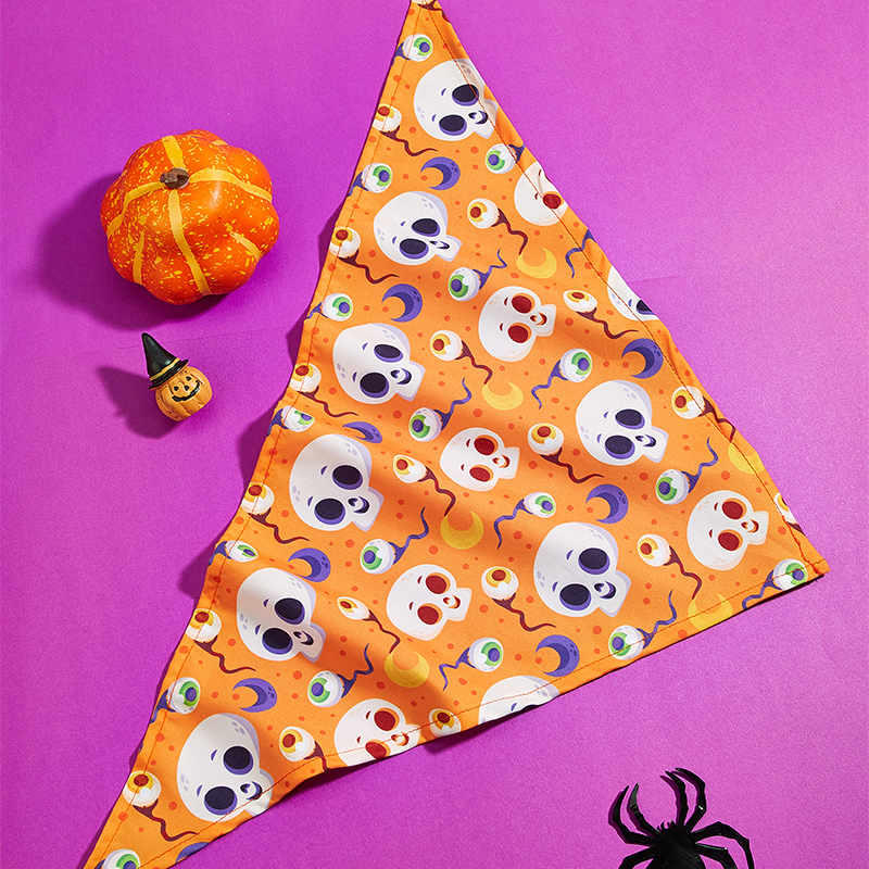 Halloween themed pet bib featuring an orange skull design