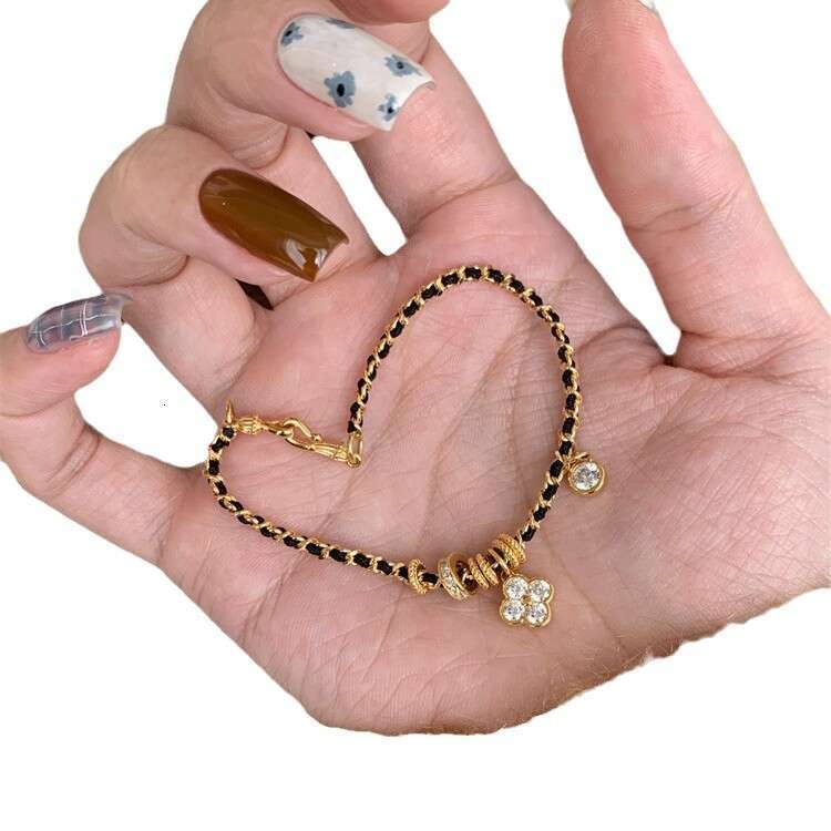 Vintage Style Four-Leaf Clover Black Gold Braided Bracelet for Women Luxurious High-End Feel Personalized Versatile Design Jewelry