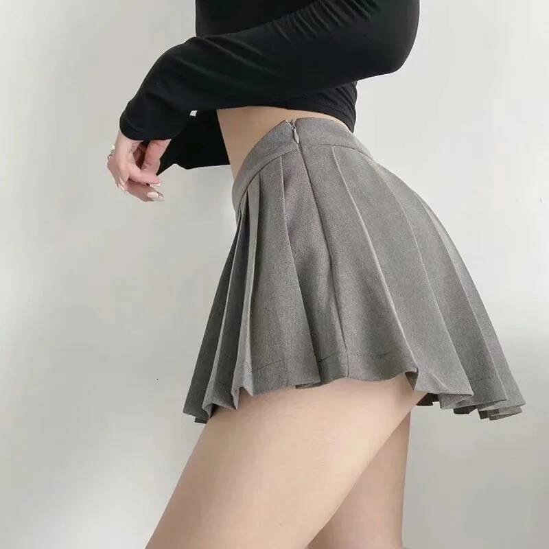 Spice girl pleated female pure color small short summer new Korean version JK college wind high waist mini skirt dongdumaoyi