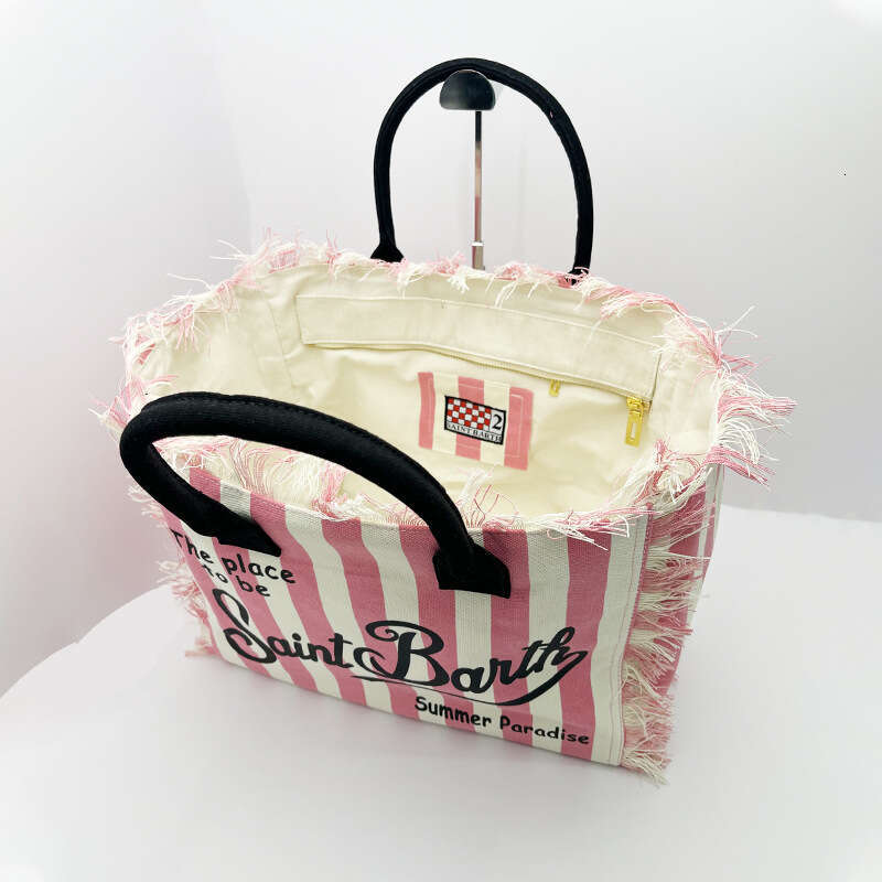 New women's high-capacity leisure travel canvas striped handmade tassel handbag tote bag from Santa Bart Europe America, new style, unique and el