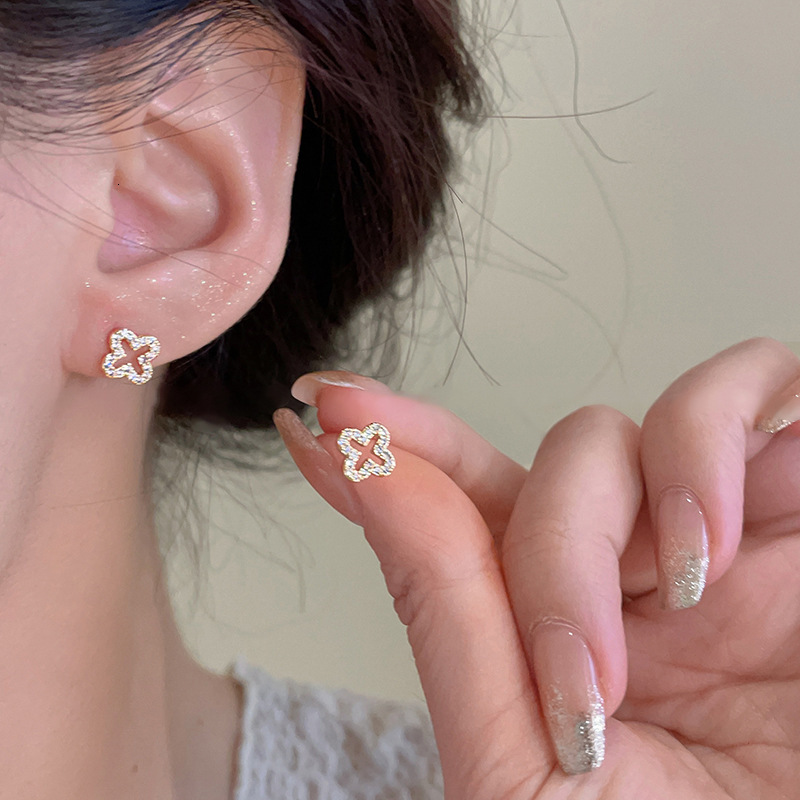 Sier Needle Zircon Four-Petal Flower Hollow Simple Fashion Commuting Versatile Earrings Niche High-End Internet Celebrity Ear Jewelry