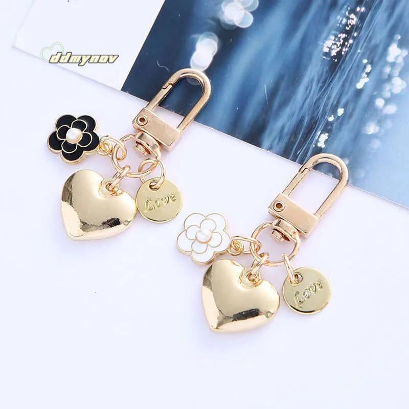 _wholesale Adorable Alloy Heart Keychain - Pearl & Camellia Flower Charm with Letter Pendant, Cute Bag Accessory for Women (8cm, 12g) ddmynov