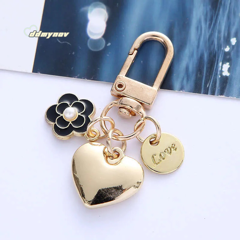 _wholesale Adorable Alloy Heart Keychain - Pearl & Camellia Flower Charm with Letter Pendant, Cute Bag Accessory for Women (8cm, 12g) ddmynov