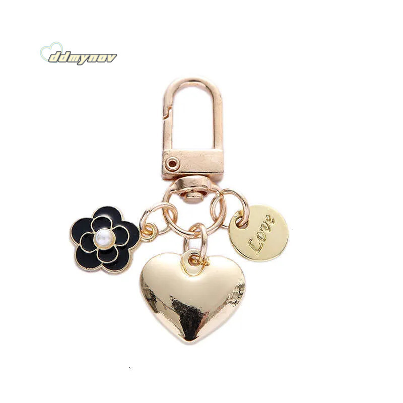 _wholesale Adorable Alloy Heart Keychain - Pearl & Camellia Flower Charm with Letter Pendant, Cute Bag Accessory for Women (8cm, 12g) ddmynov