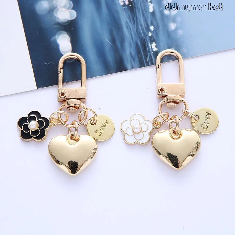 DHpet Keychain with Pearl & Camellia Flower Charm - Alloy Heart Shape Keyring, Cute Bag Accessory for Women (3.1in, 0.4oz) ddmymarket