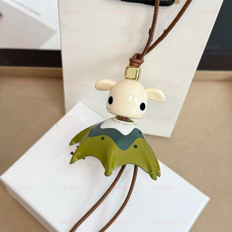 Kiwi Puzz charm calfskin and etate with looped Leather strap Anagram dice Keychains Bag Charm Exquisite Pendant Woman Cute Bkpk Bags cessories Handbag