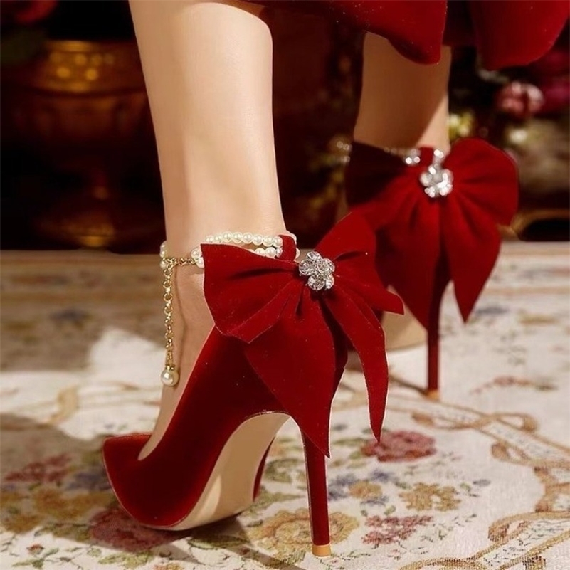 Red Xiuhe wedding shoes pointy stiletto high heels female shallow mouth bow pearl one word buckle strap two wear bride shoes 250917