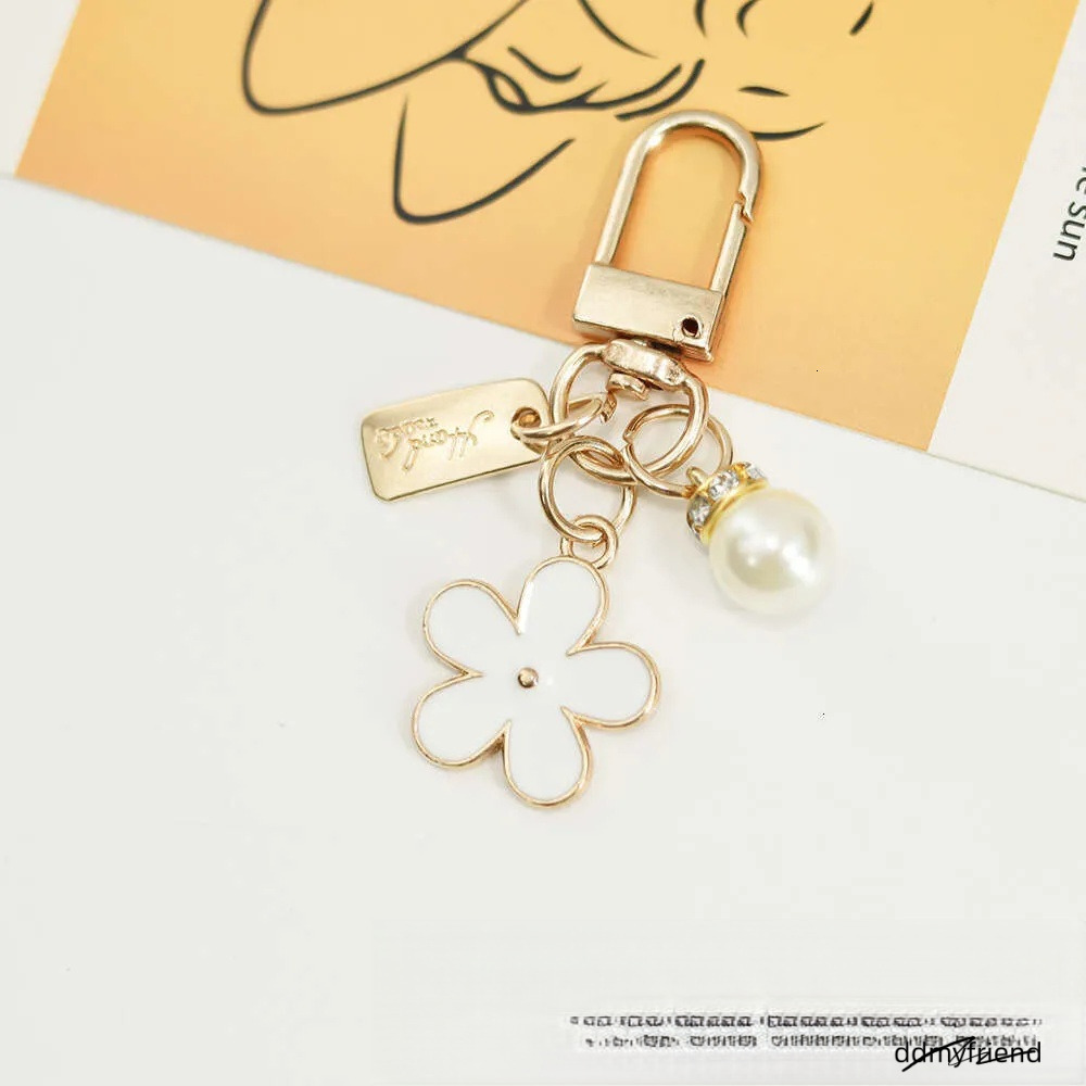 INS Metal Daisy Pearl Keychain Niche Flower Bluetooth Earphone Case Accessories ddmyfriend