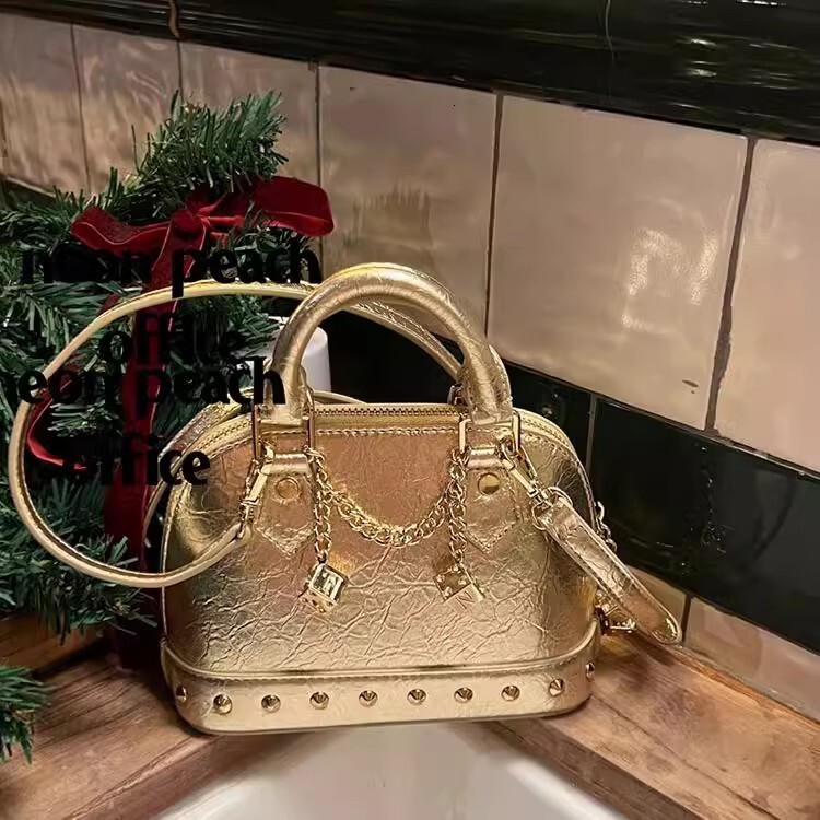 spice girls European and American style rivet shell bag new rivet clutch commuter light luxury shoulder width bag designer handbag