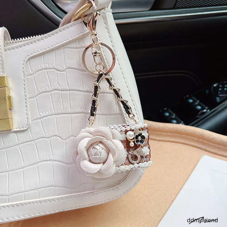 Wholesale Chic Camellia Keychain - Fashion Bag Charm For Women, Elegant Zinc Alloy Car Key Ring In Black/White/Khaki (24G) ddmyfriend