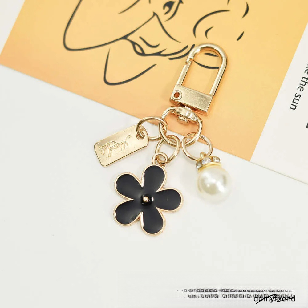 INS Metal Daisy Pearl Keychain Niche Flower Bluetooth Earphone Case Accessories ddmyfriend