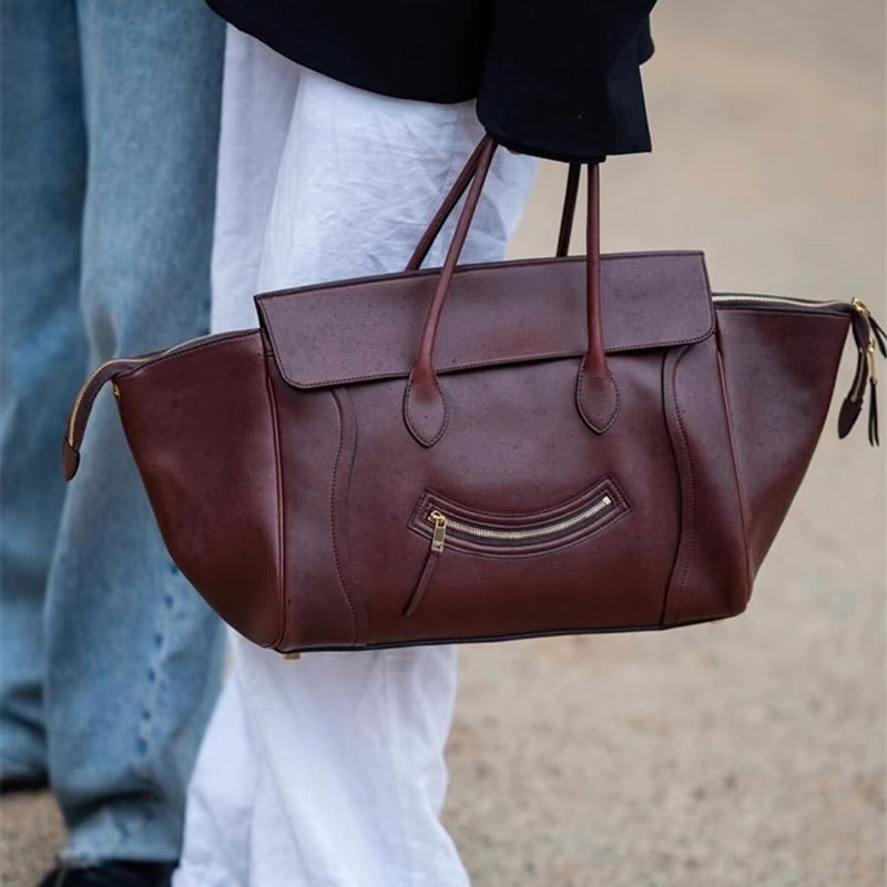 Handbag new smile wing bag large capacity soft leather temperament bag woman simple commuter tote bag woman