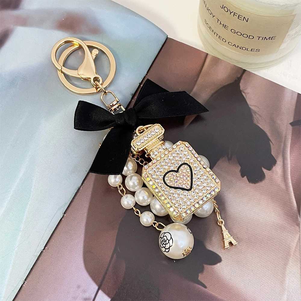 Fashion 1Pc Elegant Artificial Pearl Perfume Bottle Keychain With Bowknot Faux Pearl Charm Perfect Chic Accessory For Car Keys Handbags9 D250925