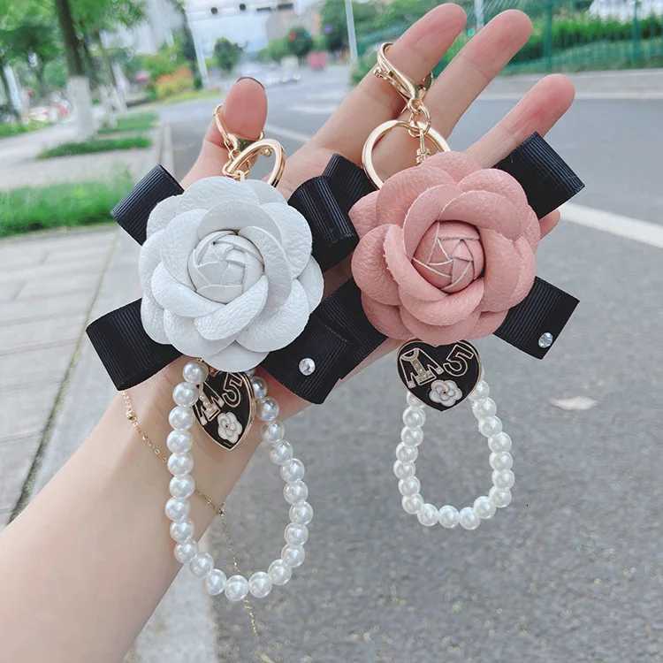 Fashion Fashion Creative Leather Bow Camellia Keychain Pearl Chain Rose Bag Pendant Accessories D250924