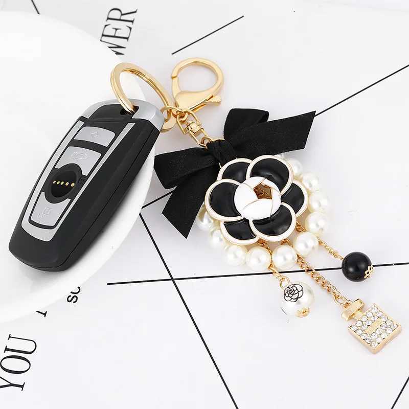 Fashion Luxury Pearl Oil Camellia Bow Tie Car Key Chains Women Bag Handbag Pendants Bottle Keychain Gift Jewelry18 D250925
