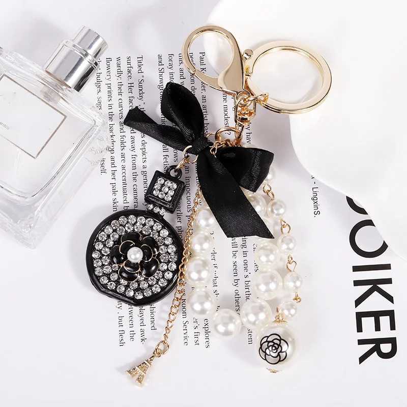 Fashion Elegant Perfume Bottle Keychain For Women and Girls BowKnot Faux Pearl Cute Handbag Key Chain Car Creative Gift White D250924