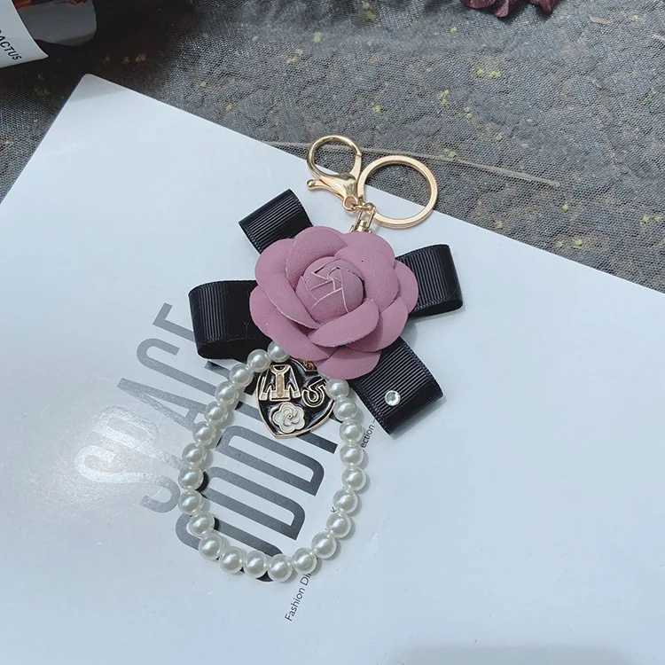 Fashion Fashion Creative Leather Bow Camellia Keychain Pearl Chain Rose Bag Pendant Accessories3 D250925