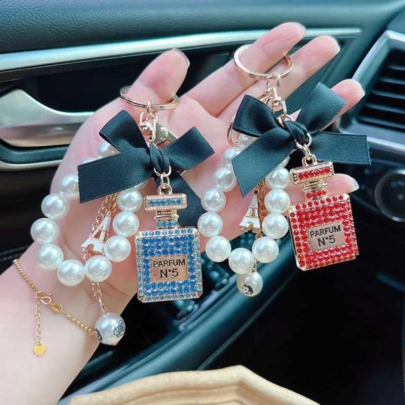 Fashion Exquisite Key Chain Alloy Diamond Inlaid Bow Shaped Perfume Bottle Key Chain Creative Pearl Chain Bag Pendant Car Keychain D250925