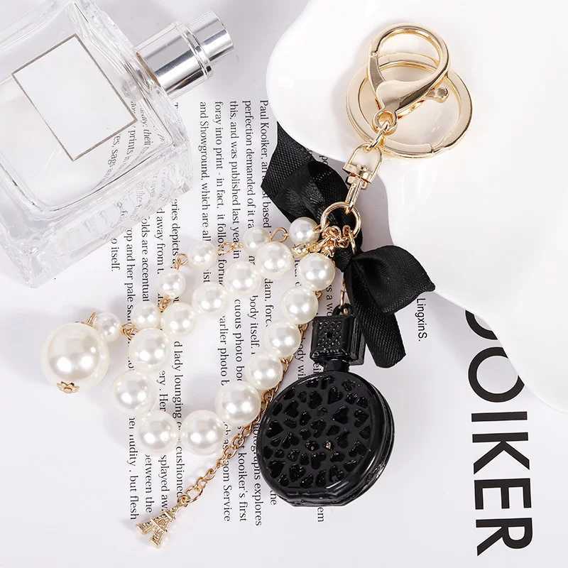 Fashion Elegant Perfume Bottle Keychain For Women and Girls BowKnot Faux Pearl Cute Handbag Key Chain Car Creative Gift White D250924