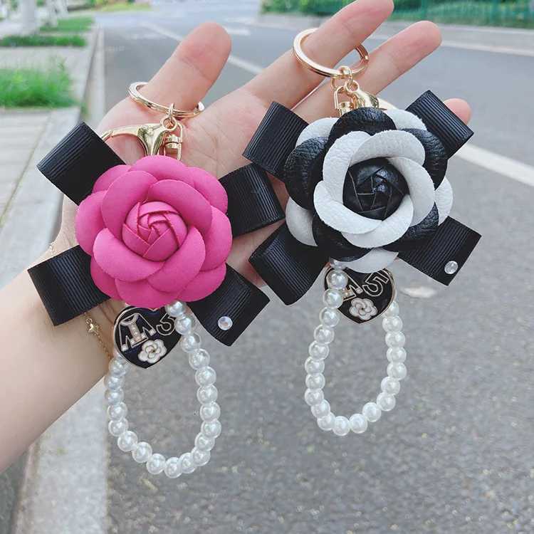 Fashion Fashion Creative Leather Bow Camellia Keychain Pearl Chain Rose Bag Pendant Accessories D250924