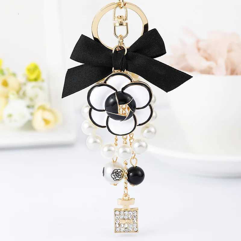 Fashion Luxury Pearl Oil Camellia Bow Tie Car Key Chains Women Bag Handbag Pendants Bottle Keychain Gift Jewelry18 D250925