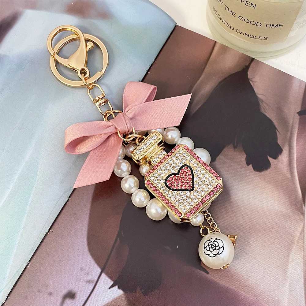 Keychains Lanyards Fashion 1Pc Elegant Artificial Pearl Perfume Bottle Keychain With Bowknot Faux Pearl Charm Perfect Chic Accessory For Car Keys Handbags7