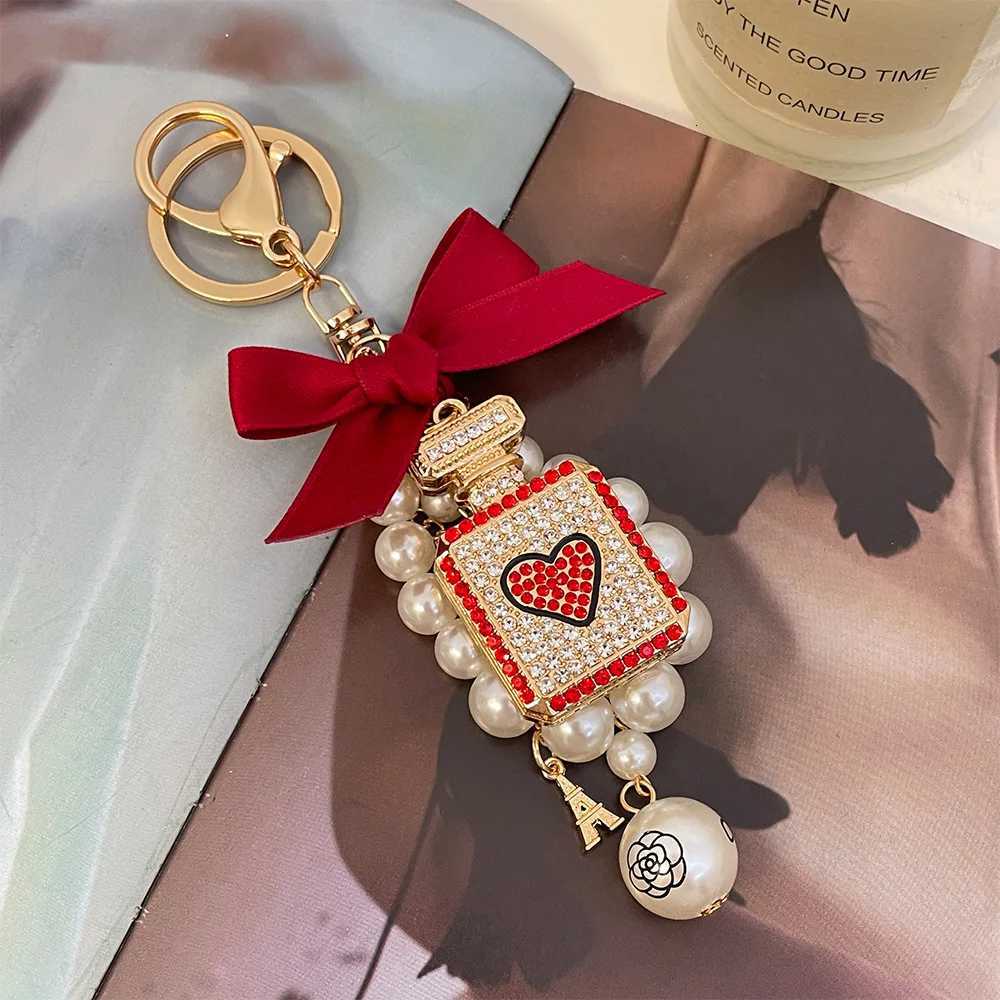 Fashion 1Pc Elegant Artificial Pearl Perfume Bottle Keychain With Bowknot Faux Pearl Charm Perfect Chic Accessory For Car Keys Handbags7 D250925