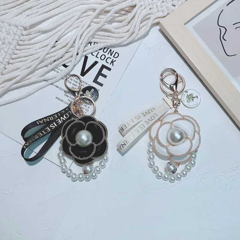 Fashion Pearl String Camellia Keychain Fashionable and Personalized Bag Pendant1 D250925