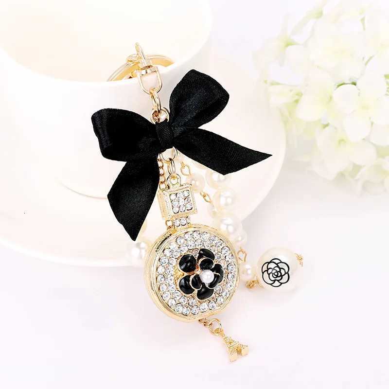 Fashion Elegant Perfume Bottle Keychain For Women and Girls BowKnot Faux Pearl Cute Handbag Key Chain Car Creative Gift White D250924