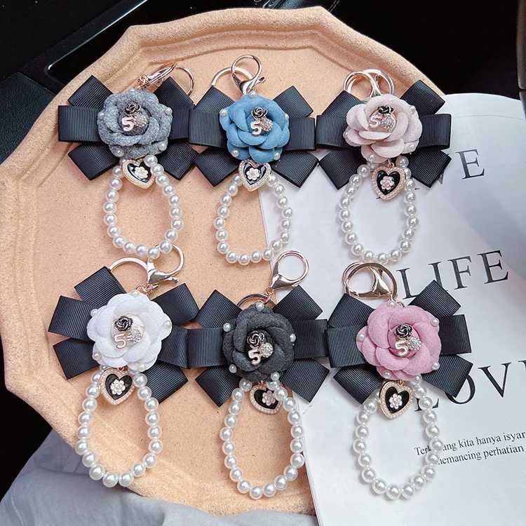 Fashion Creative Thread Camellia Flower Key Chain Pearl Chain Fashion Personality Bag Pendant for Women Car Keychain Accessories6 D250925