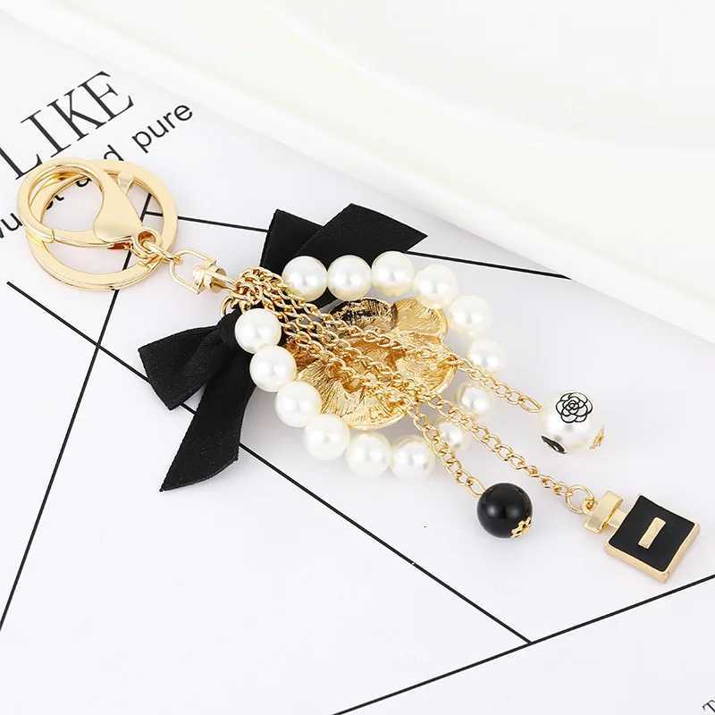 Fashion Luxury Pearl Oil Camellia Bow Tie Car Key Chains Women Bag Handbag Pendants Bottle Keychain Gift Jewelry18 D250925