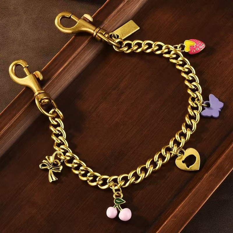 Fashion Dinosaur Cherry Motif Chain Bag Charm Accessories Designer Womens Bag or Keychain Pendant co ch Decoration Personalized Womens Wallet chain Bracelet