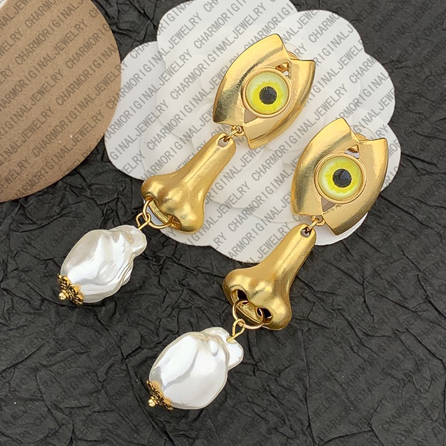 schiaparelliearrings designer earrings women eyes nose pearl drop earrings luxury jewlery designer for women artistic surreal statement elegant vintage gift