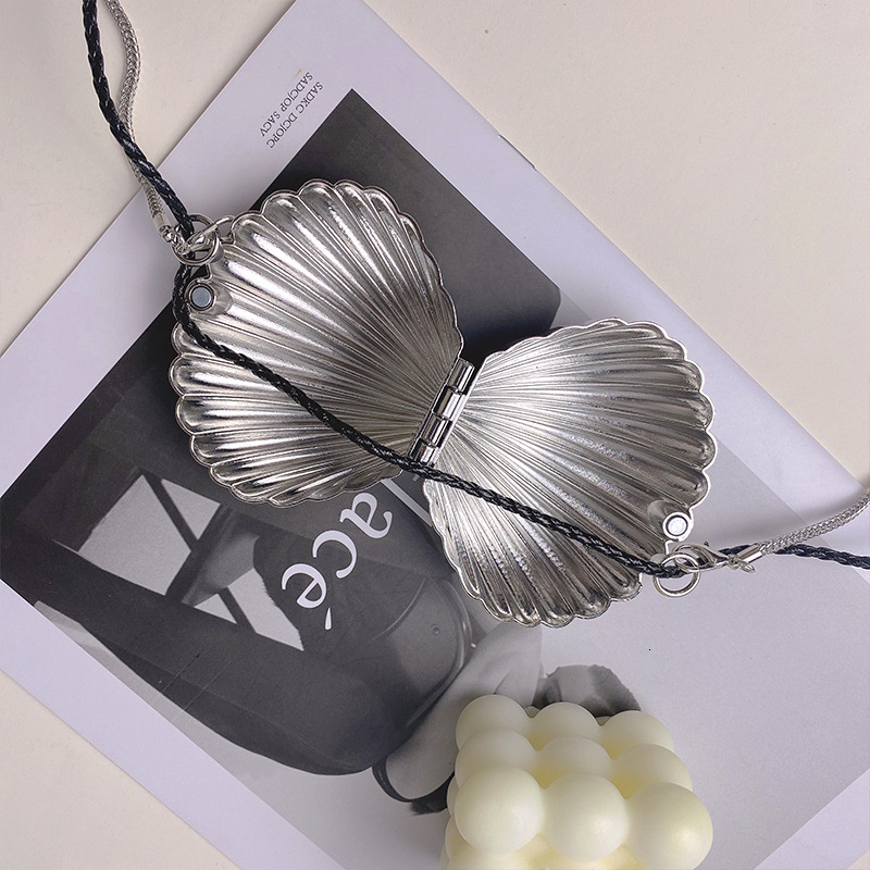 2025 French bag autumn and winter women's metal shell bag new fashion, light luxury, retro style chain shoulder crossbody bag mini wallet designe