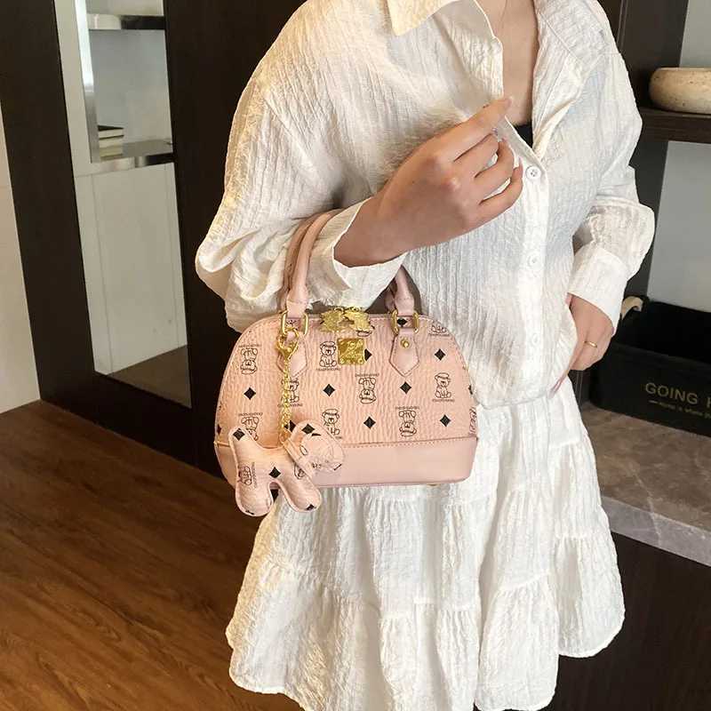 2025 Ladies High sense Shell Messenger Bag Small in Size Adorned with Bear Print Exuding Niche Fashion and TemperamentW250926