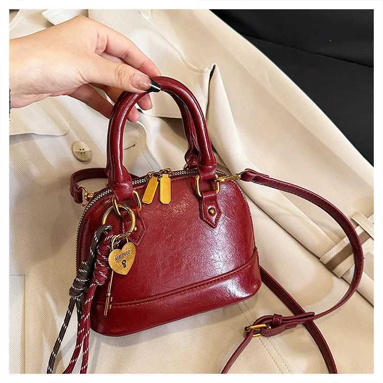 2025 Spring Summer Womens Korean Shell Bag Stylish Handheld Shoulder Crossbody Purse Niche Minimalist Versatile ChicW250926