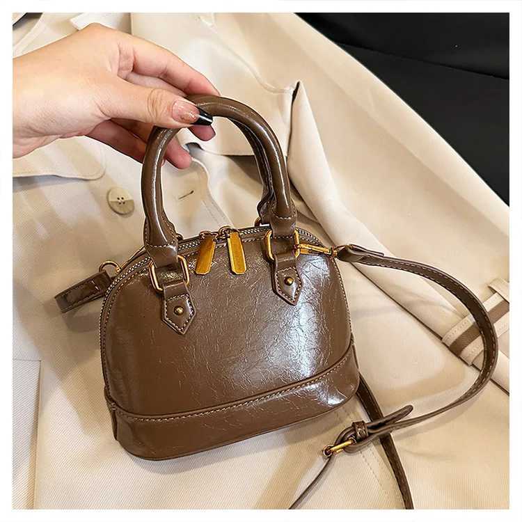 2025 Spring Summer Womens Korean Shell Bag Stylish Handheld Shoulder Crossbody Purse Niche Minimalist Versatile ChicW250926