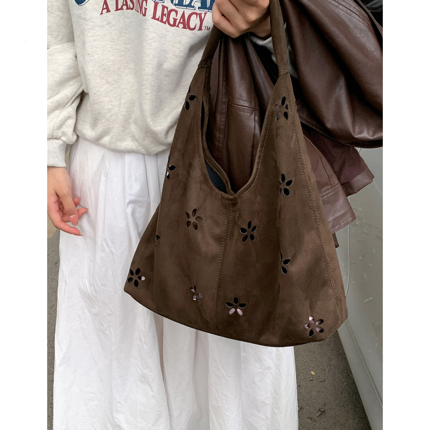 French style large capacity underarm commuting bag with retro and trendy design, autumn new style suede design, hollow handbag, light luxury designer 