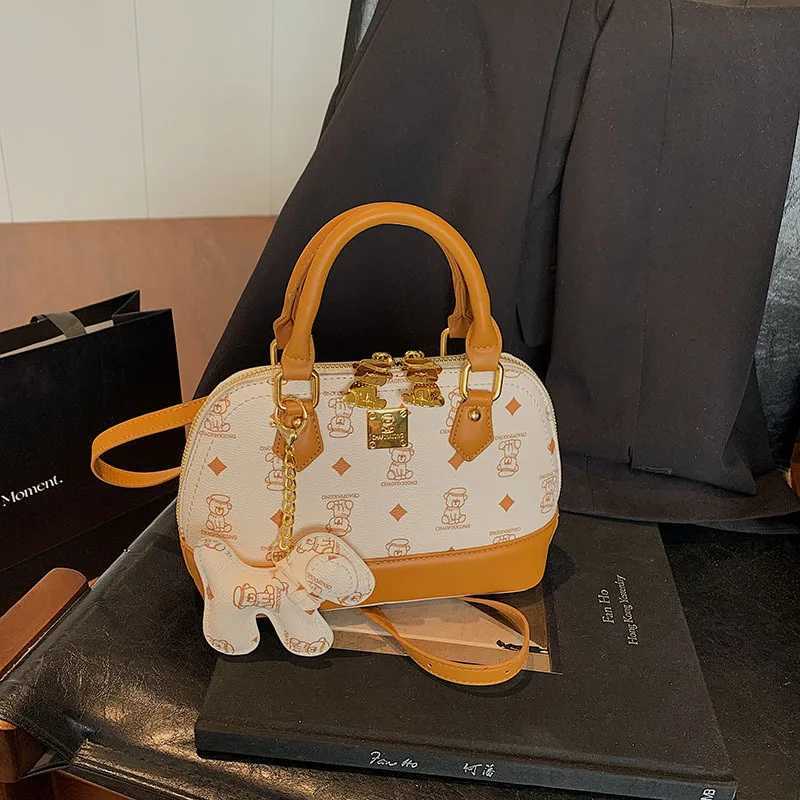 2025 Ladies High sense Shell Messenger Bag Small in Size Adorned with Bear Print Exuding Niche Fashion and TemperamentW250926