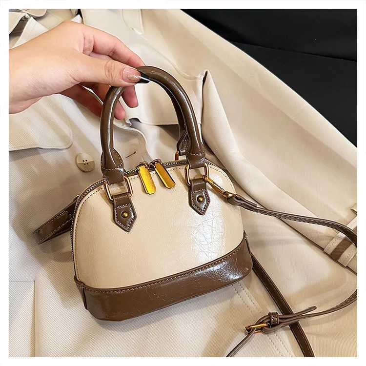 2025 Spring Summer Womens Korean Shell Bag Stylish Handheld Shoulder Crossbody Purse Niche Minimalist Versatile ChicW250926
