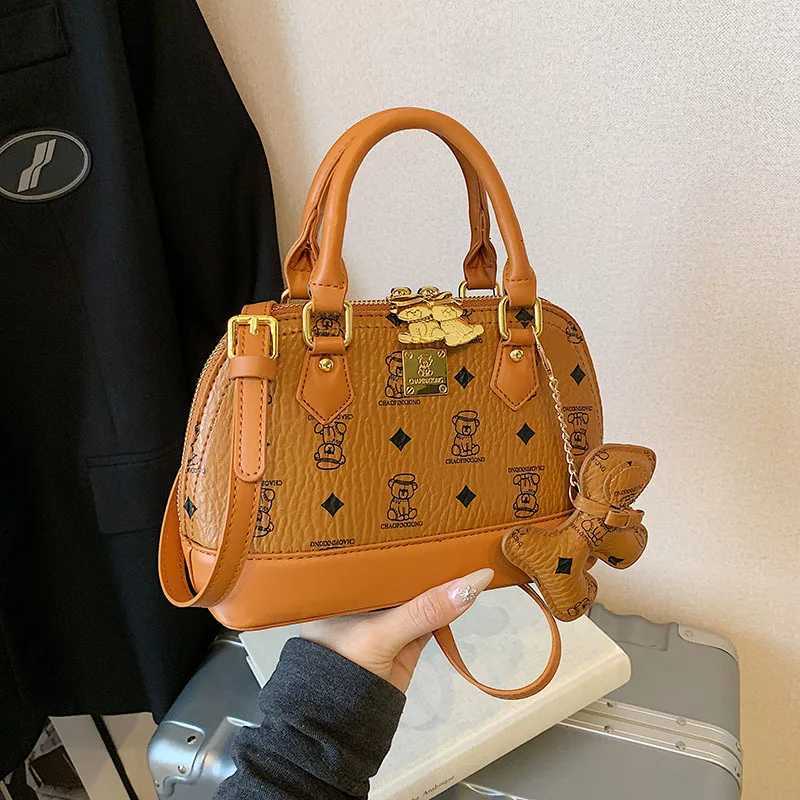 2025 Ladies High sense Shell Messenger Bag Small in Size Adorned with Bear Print Exuding Niche Fashion and TemperamentW250926