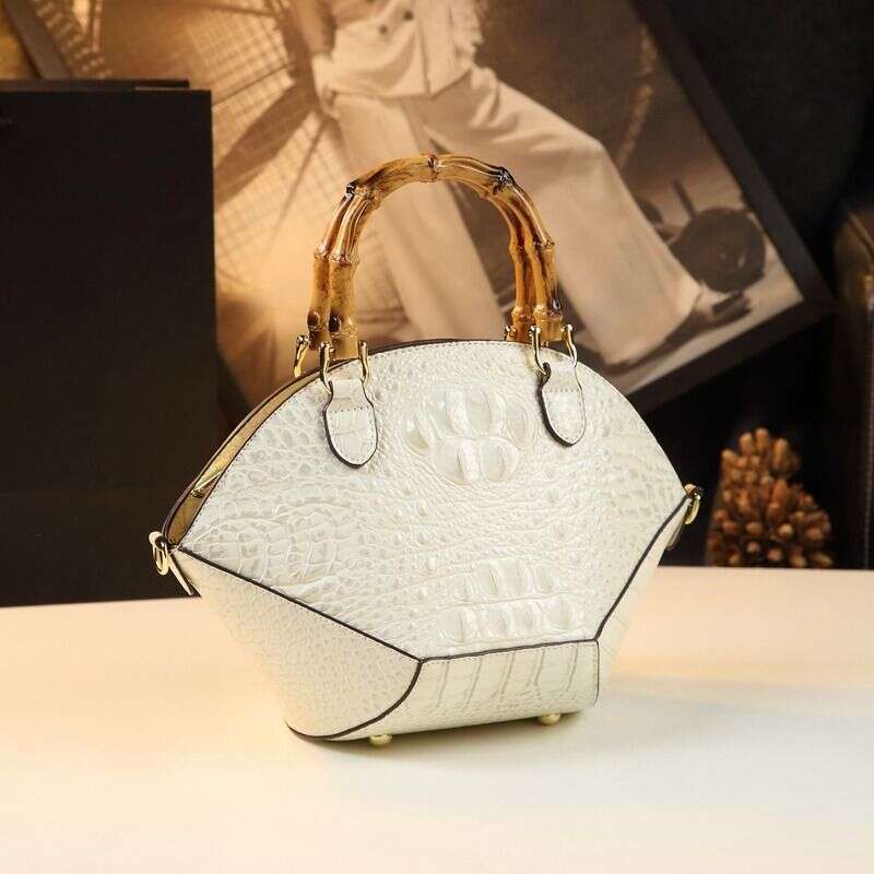 Hard skin women's bag new fashionable bamboo section handbag atmospheric niche design shell shoulder cross
