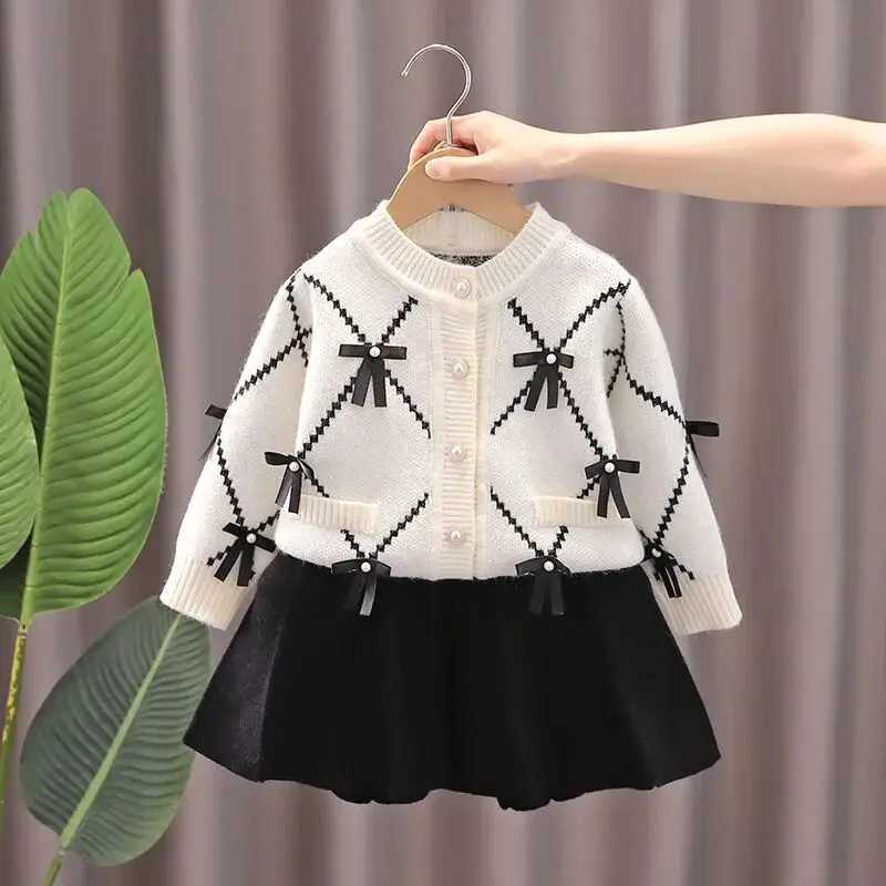 Girls Sweater Set for AutumnWinter 2025 New Childrens Bow Knitted Round Neck CardiganSkirt 2piece Set L250926BT6U