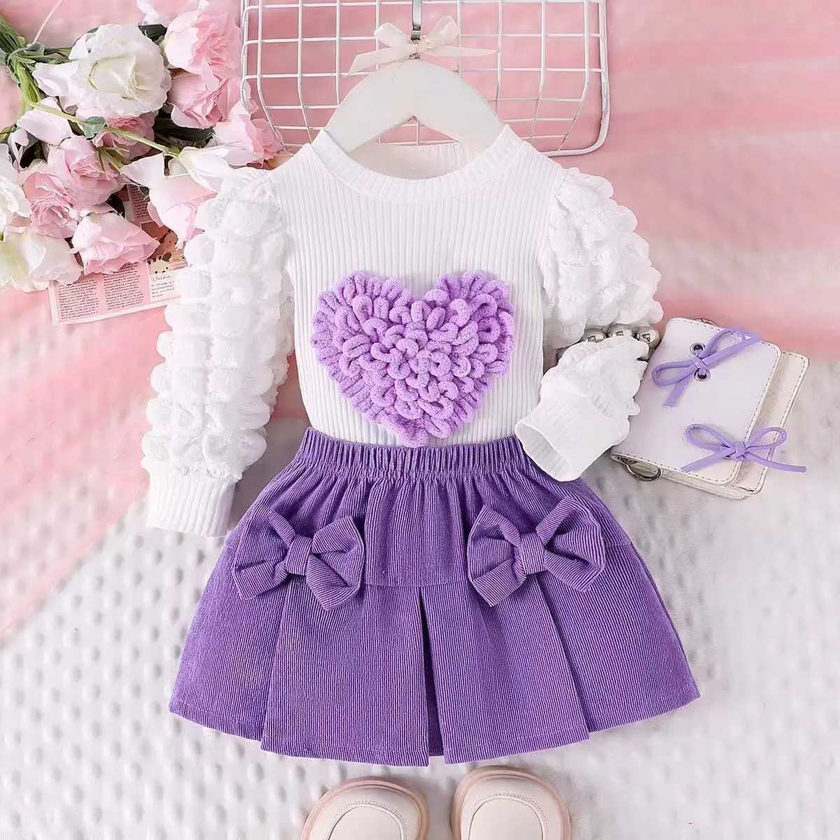 Childrens Spring and Autumn Set Girls New Bubble Sleeve Love TopBow Short Skirt Two Piece Set Kids Outfits L250926DUIQ