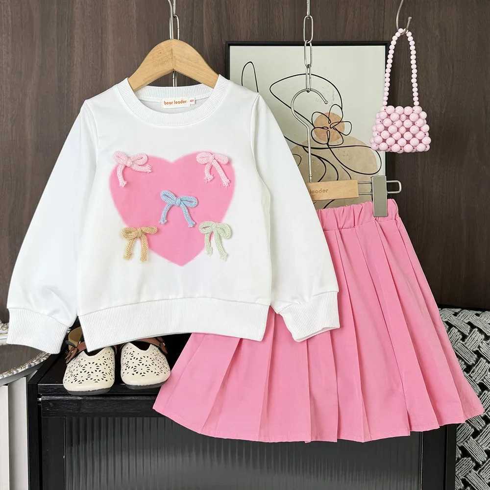 Sweet and Energetic Girl Casual Suit with Long Sleeved Bow and Heartshaped Decorationpleated Skirt Twopiece Set for Autumn L2509263DAE