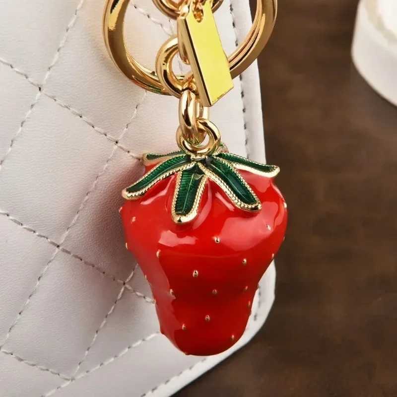 Luxury Artificial tree strawberry trend 2025 Womens keychain Golden Strawberry Series cherry bag Pendant Y250928as