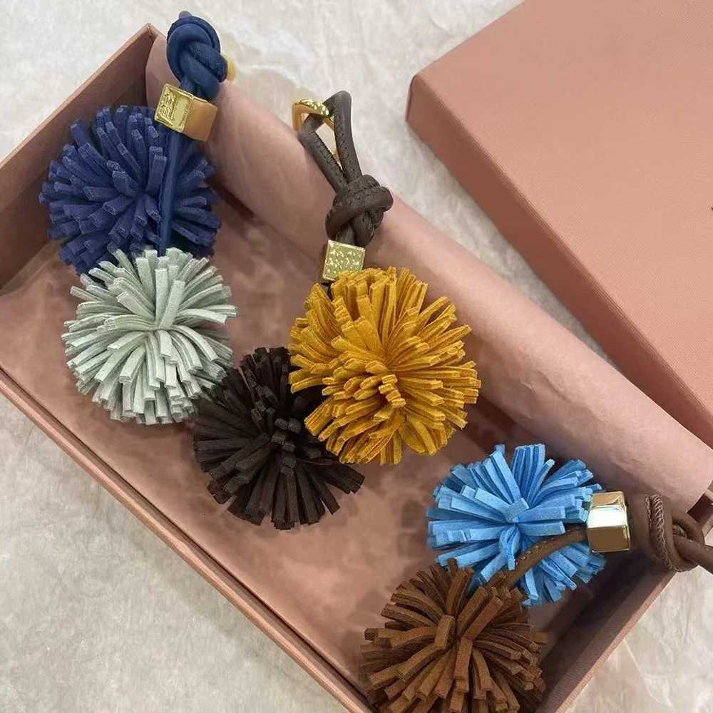 Luxury Flower Ball Leather Pendant Cowhide Rope Bags Luxury Design Charm Keychain Car Pendant For Woman Bag Accessories Handbag Y250928