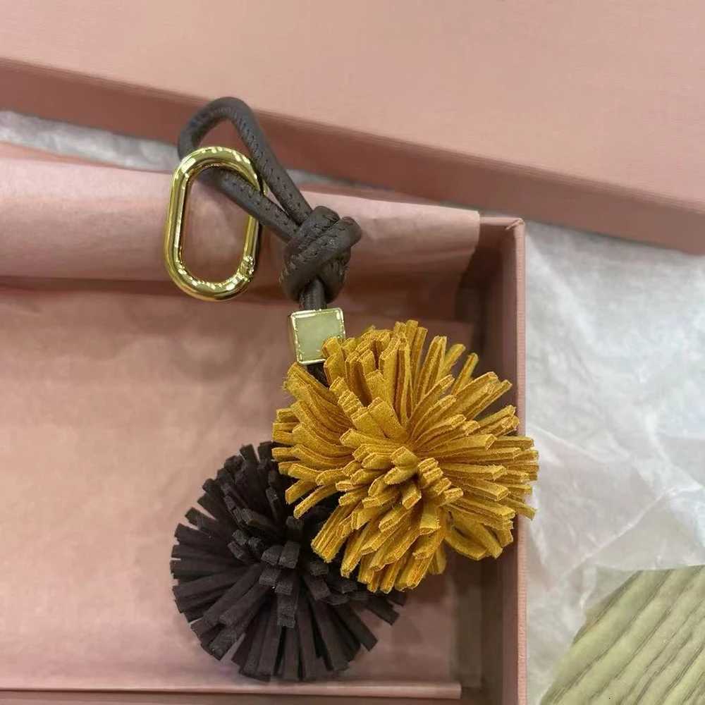 Luxury Flower Ball Leather Pendant Cowhide Rope Bags Luxury Design Charm Keychain Car Pendant For Woman Bag Accessories Handbag Y250928