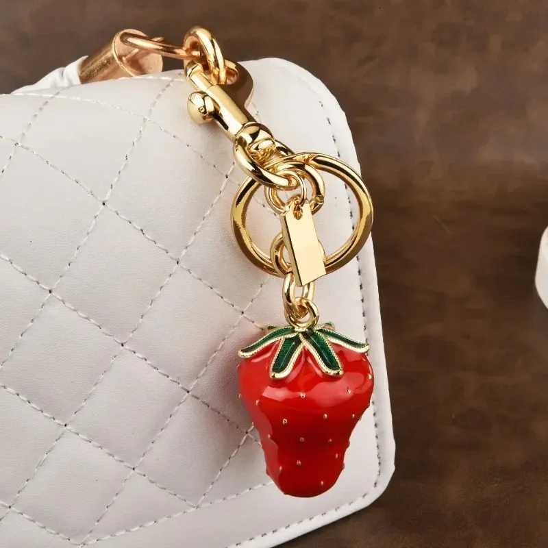 Luxury Artificial tree strawberry trend 2025 Womens keychain Golden Strawberry Series cherry bag Pendant Y250928as