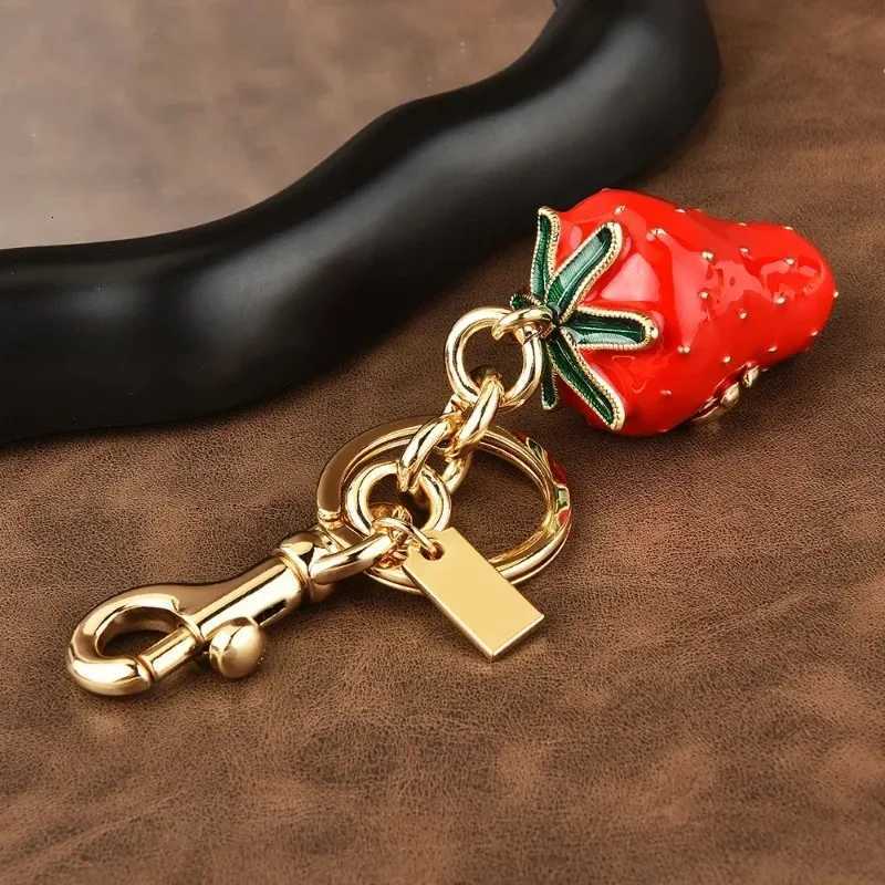 Luxury Artificial tree strawberry trend 2025 Womens keychain Golden Strawberry Series cherry bag Pendant Y250928as